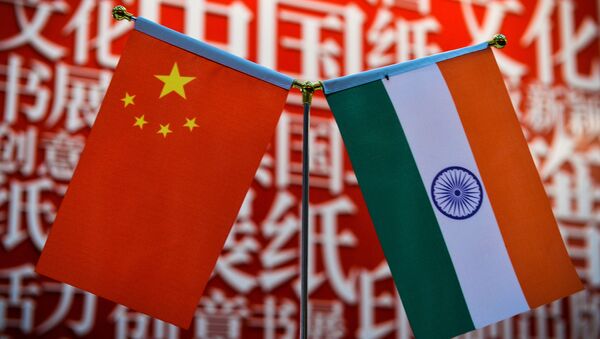 The national flags of India (R) and China are seen at the Delhi World Book fair at Pragati Maidan in New Delhi on January 9, 2016.  - Sputnik International