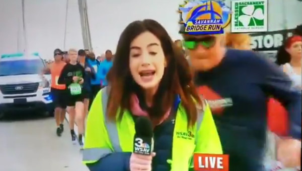 Screenshot of Georgia NBC News affiliate (WSAV) reporter groped on live television by participant in running event in Savannah, Georgia, United States - 07.12.2019 - Sputnik International