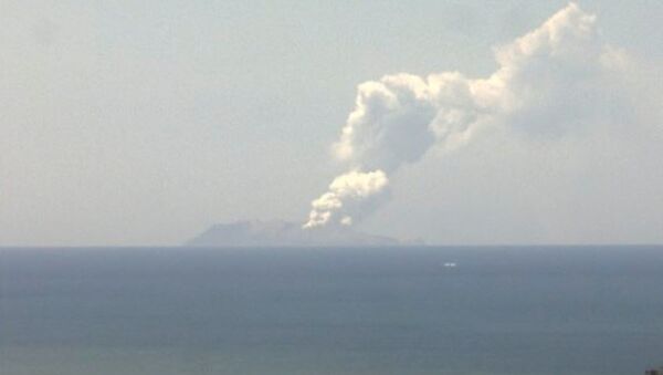 Smoke bellows from Whakaari, also known as White Island, volcano as it erupts in New Zealand, December 9, 2019, in this image obtained via social media.  - Sputnik International