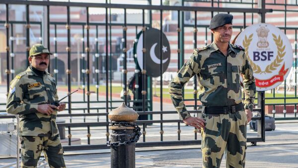 Border Security Force (BSF) personnel stand guard at the India-Pakistan Wagah Border about 35 kms from Amritsar on December 4, 2019 - Sputnik International