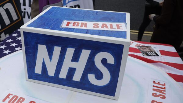 NHS Logo on Box During Demo - Sputnik International