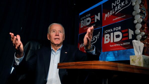 Democratic 2020 U.S. presidential candidate and former U.S. Vice President Joe Biden answers a question on  Biden's No Malarkey! campaign bus before an event in Elkader, Iowa, U.S., December 6, 2019 - Sputnik International