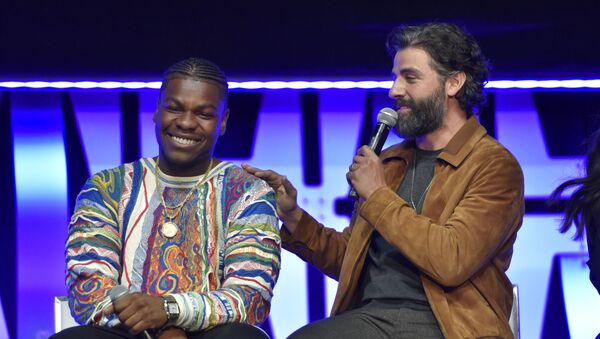 John Boyega, from left, and Oscar Isaac participate during the Star Wars: The Rise Of Skywalker panel on day 1 of the Star Wars Celebration at Wintrust Arena on Friday, April 12, 2019, in Chicago. - Sputnik International