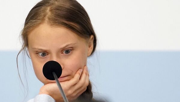 Climate change activist Greta Thunberg reacts during a news conference during COP25 climate summit in Madrid, Spain, December 9, 2019 - Sputnik International
