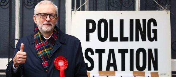 Britain's opposition Labour Party leader Jeremy Corbyn poses outside a polling station after voting in the general election in London, Britain, December 12, 2019 - Sputnik International