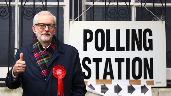 Britain's opposition Labour Party leader Jeremy Corbyn poses outside a polling station after voting in the general election in London, Britain, December 12, 2019 - Sputnik International