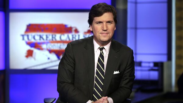 FILE - In this March 2, 2017, file photo, Tucker Carlson, host of Tucker Carlson Tonight, poses for photos in a Fox News Channel studio in New York - Sputnik International