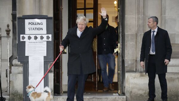 Britain's Prime Minister and Conservative Party leader Boris Johnson with his dog Dilyn leaves after voting in the general election at Methodist Central Hall, Westminster, London, Thursday, Dec. 12, 2019.  - Sputnik International