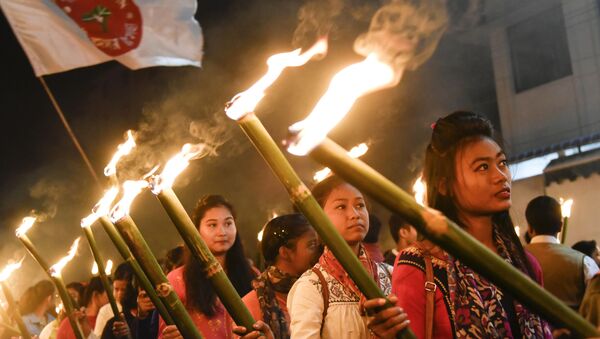 Activists of All Assam Students Union (AASU) take part in a torch light procession to protest against the government's Citizenship Amendment Bill, in Guwahati on December 8, 2019 - Sputnik International