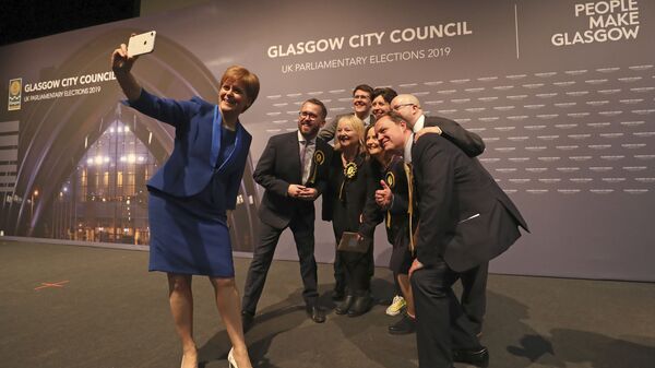 Scottish First Minister Nicola Sturgeon takes a photo with party members at the SEC Centre in Glasgow after the declaration in her constituency in the 2019 general election, Friday Dec. 13, 2019 - Sputnik International