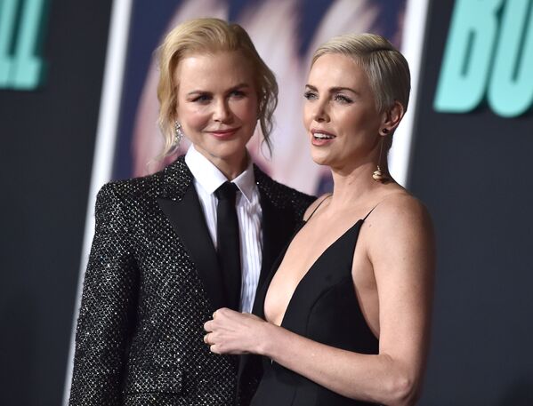 Australian actress Nicole Kidman (L) and South African actress Charlize Theron arrive for Lionsgate's special screening of Bombshell at the Regency Village Theatre in Westwood, California on December 10, 2019 - Sputnik International