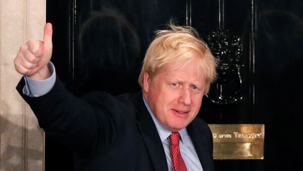 Britain's Prime Minister Boris Johnson gestures as he arrives at 10 Downing Street on the morning after the general election in London, Britain, December 13, 2019 - Sputnik International