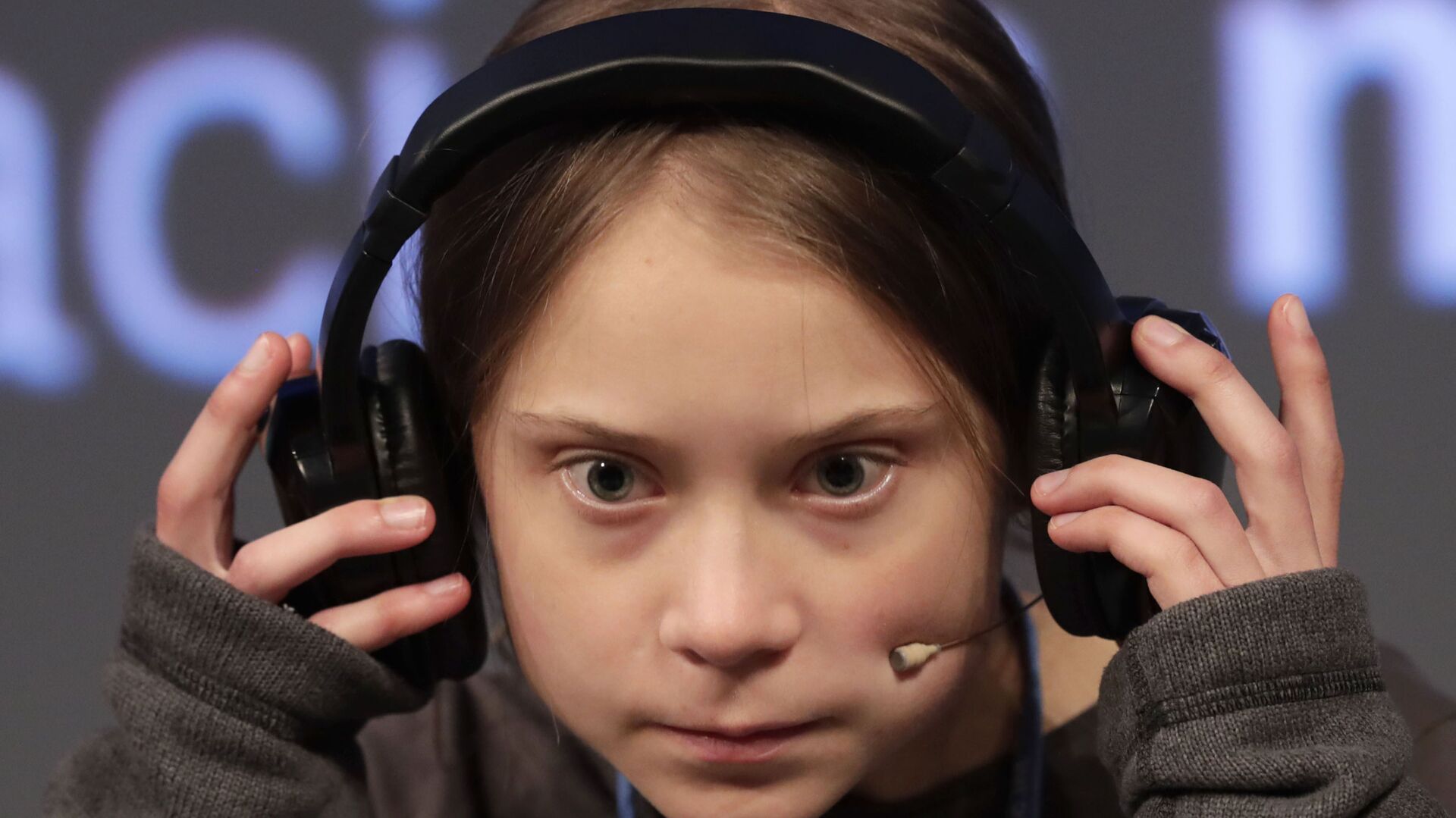 Climate activist Greta Thunberg adjusts the headphones during a press conference in Madrid, Friday Dec. 6, 2019 - Sputnik International, 1920, 03.11.2021