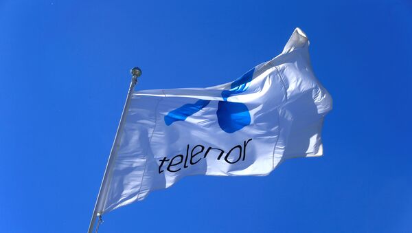 Telenor flag flutters next to the company's headquarters in Fornebu, Norway, June 1, 2017. - Sputnik International