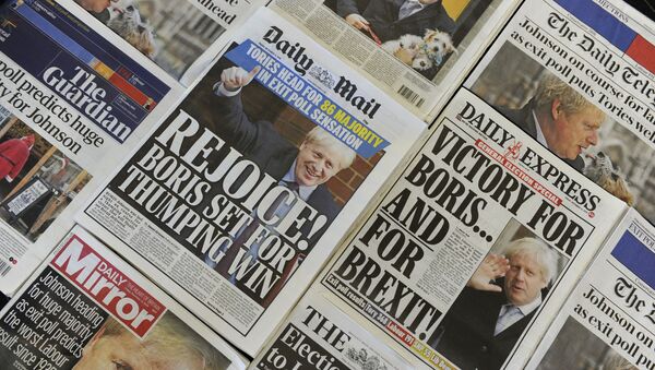 An arrangement of UK daily newspapers photographed as an illustration in London on December 13, 2019 shows front page headlines reporting on the projected election result based on exit polls in the UK general election. - Sputnik International