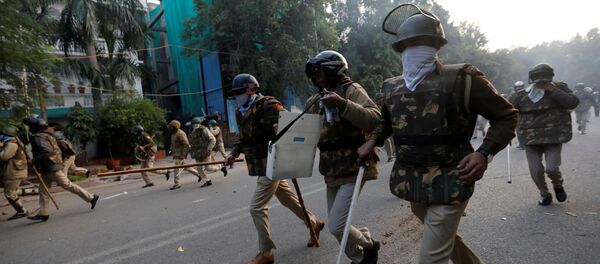 Police chase away demonstrators during a protest against a new citizenship law, in New Delhi, India, December 15, 2019 - Sputnik International