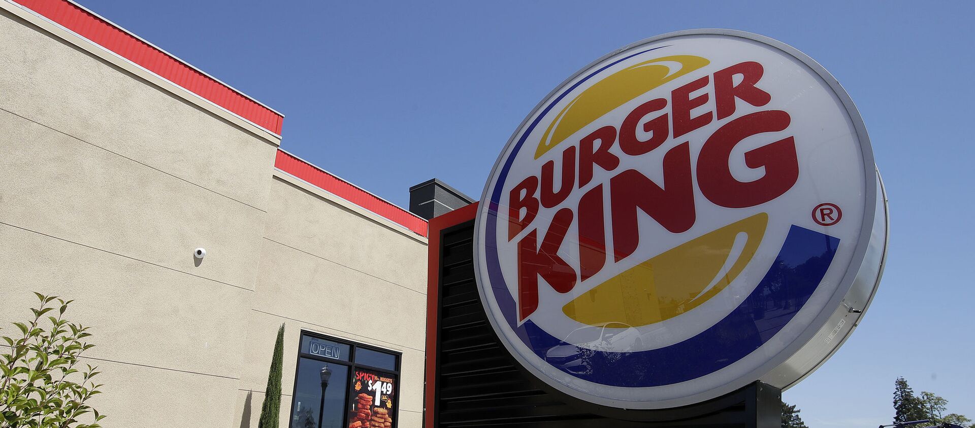 his April 25, 2019, file photo shows a Burger King in Redwood City, Calif. Burger King is introducing a plant-based burger in Europe. But it's not the Impossible Whopper that's been a hit with U.S. customers. Instead, a Dutch company called The Vegetarian Butcher will supply the new soy-based Rebel Whopper. It will go on sale Tuesday, Nov. 12, at 2,400 restaurants across Europe.  - Sputnik International, 1920, 09.03.2021