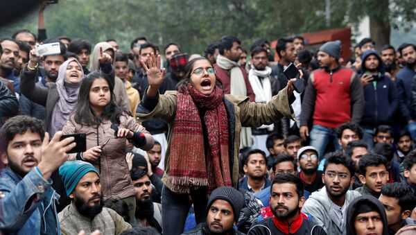 A student of the Jamia Millia Islamia university reacts during a demonstration after police entered the university campus on the previous day, following a protest against a new citizenship law, in New Delhi, India, December 16, 2019 - Sputnik International