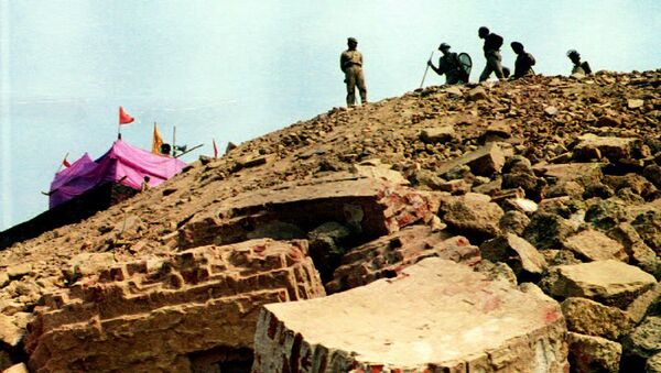 Paramilitary police position themselves on a hill overlooking the ruins of the 16th century Babri mosque (foreground) 08 December 1992 in Ayodhya, India - Sputnik International