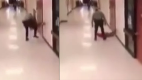 Surveillance video released this week shows a North Carolina middle school resource officer slamming a child during an apparent confrontation. - Sputnik International