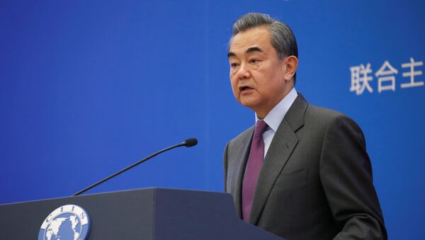Chinese Foreign Minister Wang Yi delivers a speech at an annual symposium on international situation and China's diplomacy in Beijing, China December 13, 2019. - Sputnik International