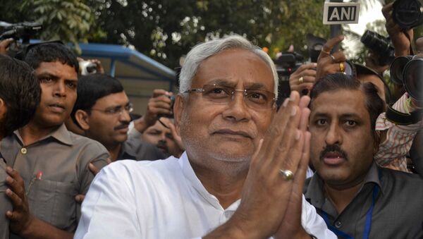 Bihar Chief Minister Nitish Kumar greets supporters after victory in Bihar state elections in Patna, India, Sunday, Nov. 8, 2015 - Sputnik International
