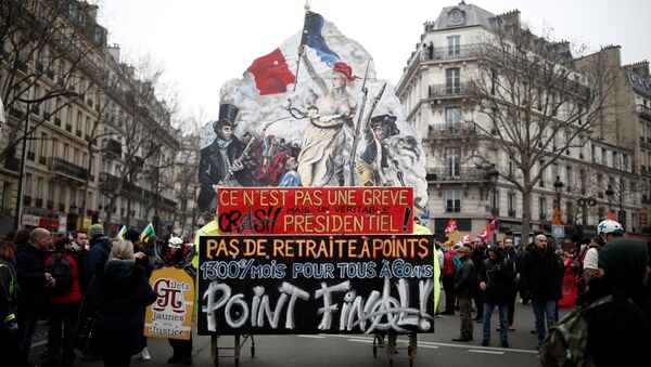 A float with a drawing of the painting La Liberte guidant le peuple (Liberty Leading the People) by Eugene Delacroix is seen during a demonstration against French government's pensions reform plans in Paris as part of a day of national strike and protests in France, December 5, 2019 - Sputnik International