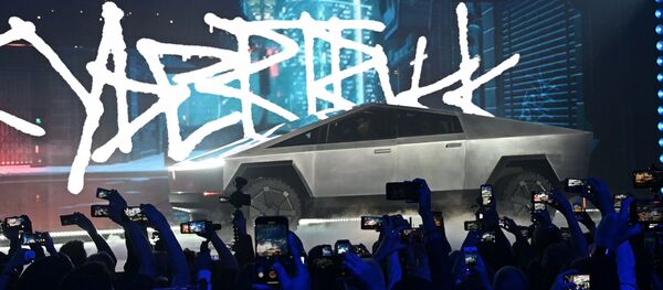 Nov 21, 2019;  Hawthorne, CA, U.S.A; The Tesla Cybertruck takes the stage at an unveiling of the long awaited pickup truck from the company at the TeslaDesign Studio in Hawthorne, Calif. - Sputnik International