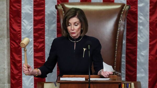 U.S. Speaker of the House Nancy Pelosi (D-CA) bangs the gavel to adjourn the House of Representatives after representatives voted in favor of two counts of impeachment against U.S. President Donald Trump in the House Chamber of the U.S. Capitol in Washington, U.S., December 18, 2019. - Sputnik International