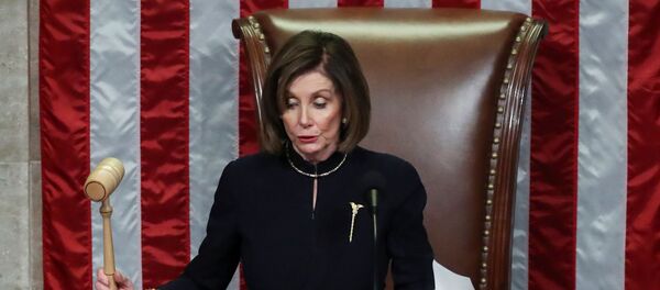 U.S. Speaker of the House Nancy Pelosi (D-CA) bangs the gavel to adjourn the House of Representatives after representatives voted in favor of two counts of impeachment against U.S. President Donald Trump in the House Chamber of the U.S. Capitol in Washington, U.S., December 18, 2019. - Sputnik International
