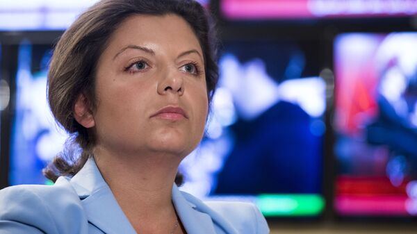 In this photo taken on Friday, Jan. 19, 2018, Margarita Simonyan, the head of the Russian television channel RT, listens to a question during her interview with the Associated Press in Moscow, Russia. Simonyan, the head of Russian television channel RT - Sputnik International