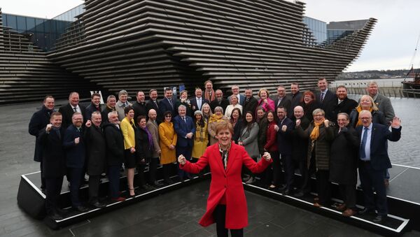 Scotland's First Minister Nicola Sturgeon poses for a photograph with newly elected SNP MP's in front of the V&A Museum in Dundee, Scotland, Britain December 14, 2019 - Sputnik International
