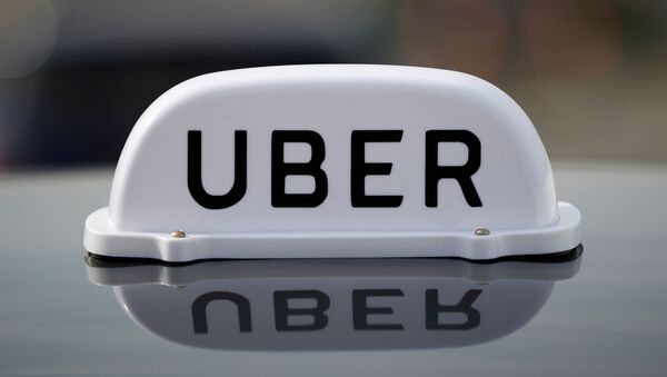 The Logo of taxi company Uber  - Sputnik International