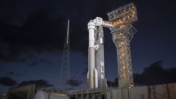 A United Launch Alliance Atlas V rocket with Boeing's CST-100 Starliner spacecraft onboard is seen illuminated by spotlights on the launch pad at Space Launch Complex 41 ahead of the Orbital Flight Test mission, Wednesday, Dec. 18, 2019 at Cape Canaveral Air Force Station in Florida - Sputnik International