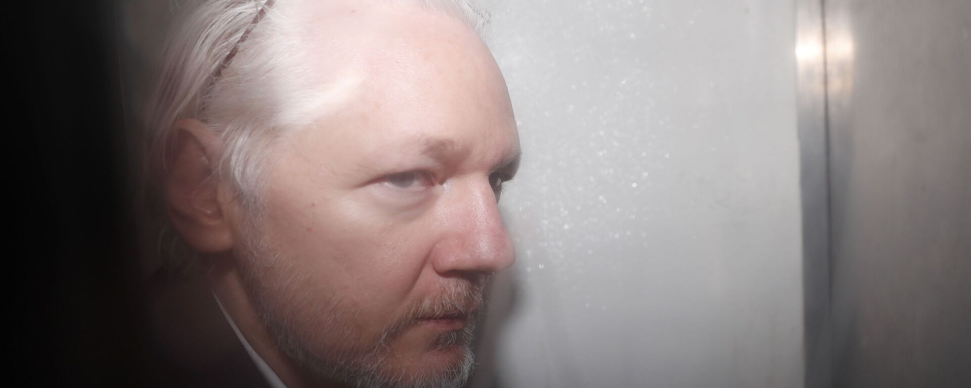 WikiLeaks founder Julian Assange is seen in a prison van traveling to Westminster Magistrates Court in London, Friday, Dec. 20, 2019. Assange is expected to appear in person before Westminster Magistrates in a private hearing related to a Spanish criminal case about alleged surveillance at the Ecuador embassy - Sputnik International, 1920, 13.12.2022