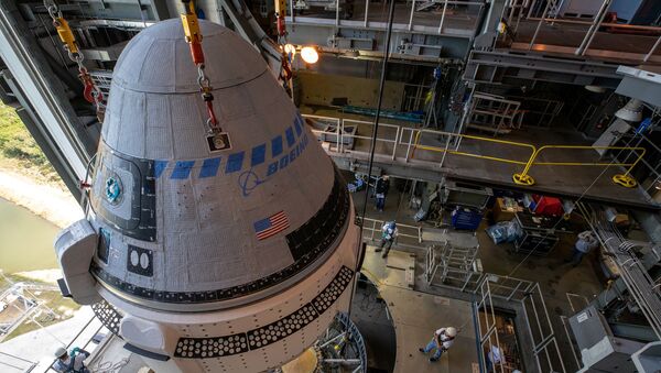The Boeing CST-100 Starliner spacecraft is guided into position above a United Launch Alliance Atlas V rocket at the Vertical Integration Facility at Space Launch Complex 41 at Cape Canaveral Air Force Station, Florida, U.S. November 21, 2019. - Sputnik International
