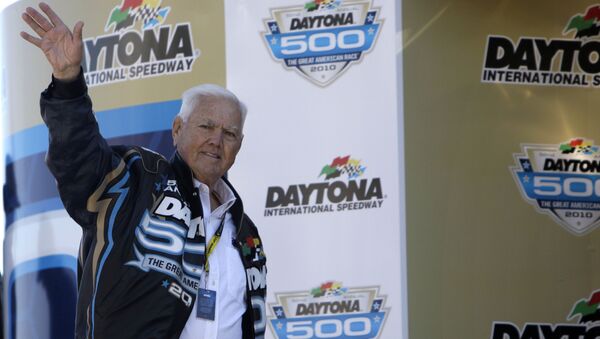 Former driver Junior Johnson waves to fans prior to the Daytona 500 NASCAR auto race at Daytona International Speedway - Sputnik International