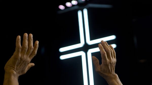 An evangelical prays during a Mass at a church in Havana, Cuba, Sunday, Jan. 27, 2019. - Sputnik International