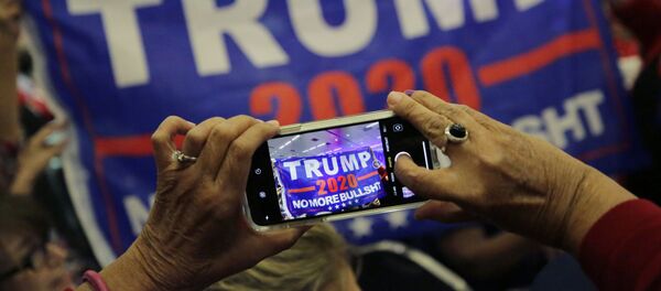 Supporters of President Donald Trump photograph a banner before a panel discussion with Donald Trump, Jr., Trump campaign senior adviser Kimberly Guilfoyle, and Trump campaign manager Brad Parscale, Tuesday, Oct. 15, 2019, in San Antonio. - Sputnik International