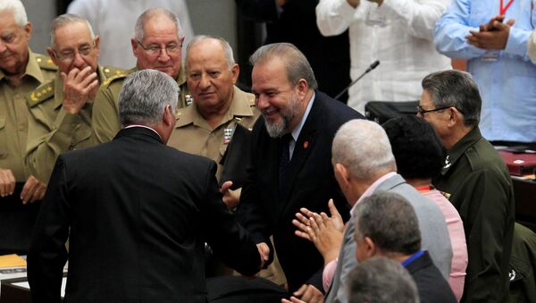Cuban President Miguel Diaz-Canel and Tourism Minister Manuel Marrero Cruz, named as the country's first prime minister, a role created by the new constitution, shake hands during the ordinary session of the National Assembly in Havana, Cuba, December 21, 2019 - Sputnik International