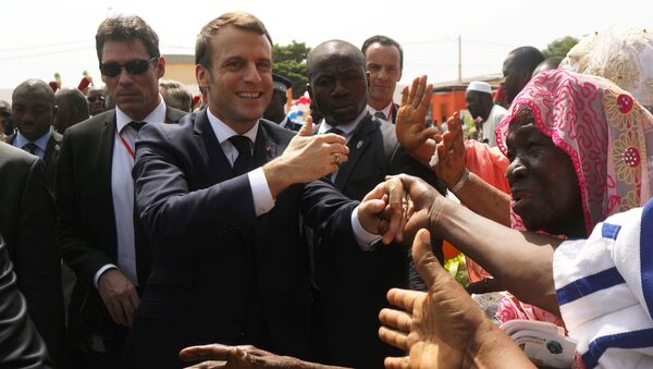 France's President Emmanuel Macron is greeted as he arrives for the inauguration of the Agora win-win in Koumassi, Abidjan, Ivory Coast, 21 December 2019 - Sputnik International