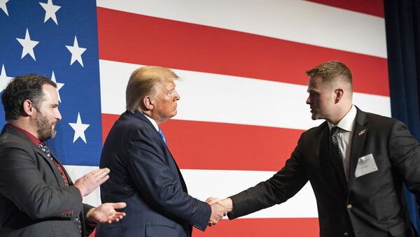 President Donald J. Trump welcomes Army First Lieutenant Clint Lorance and Army Major Mathew Golsteyn to the stage prior to his remarks at the Republican Party of Florida’s Statesman Dinner Saturday, Dec. 7, 2019, in Aventura, Fla. - Sputnik International