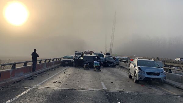 Damaged vehicles are seen after a chain reaction crash on I-64 in York County, Virginia, U.S. December 22, 2019 - Sputnik International
