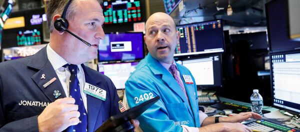 Traders work on the floor at the New York Stock Exchange (NYSE) in New York, U.S., December 17, 2019 Traders work on the floor at the New York Stock Exchange (NYSE) in New York, U.S., December 17, 2019 - Sputnik International