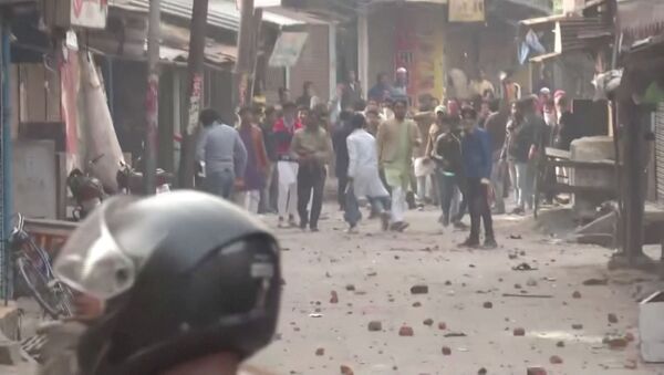 Protesters pelt police personnel with rocks during clashes over the citizenship law in Gorakhpur, Uttar Pradesh, India on 20 December 2019 in this still image taken from a video - Sputnik International