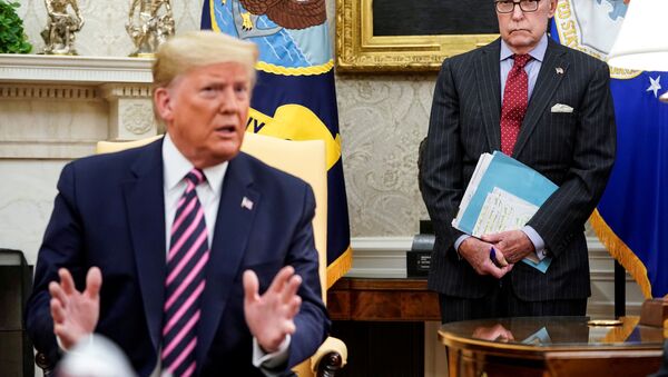 Director of the National Economic Council Larry Kudlow watches as U.S. President Donald Trump speaks with Republican members of Congress a day after the House of Representatives approved articles of impeachment against the Republican president, at the White House in Washington, U.S., December 19, 2019 - Sputnik International