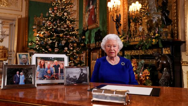 Britain's Queen Elizabeth poses, after recording her annual Christmas Day message in Windsor Castle, in Berkshire, Britain, in this undated picture released on 24 December 2019.  - Sputnik International