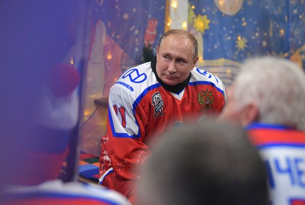 Russian President Vladimir Putin during a break in the exhibition match of the Night Hockey League on the Red Square skating rink.  - Sputnik International