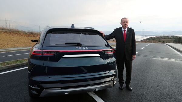 Turkish President Tayyip Erdogan poses with a prototype of the domestic electric car project in Gebze, Turkey, 27 December 2019. - Sputnik International