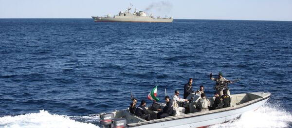 Iranian marine soldiers wave to the camera from a motor boat in the Sea of Oman during the third day of joint Iran, Russia and China naval war games Iranian marine soldiers wave to the camera from a motor boat in the Sea of Oman during the third day of joint Iran, Russia and China naval war games - Sputnik International